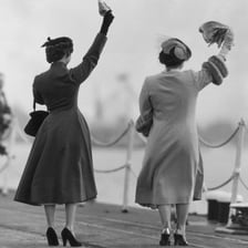 People waving goodbye to one another.