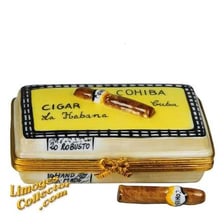 A Cohiba cigar beside its branded box