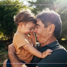 Grandparent warmly showing affection to a child