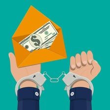 An illustration of a discreet exchange of cash representing a bribe