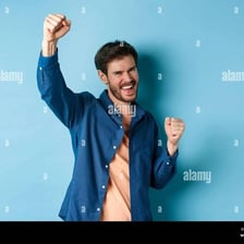 A person cheering in celebration after a victory.