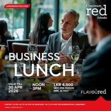 People holding a meeting over lunch.