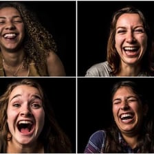 A person laughing with amusement