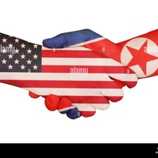 People from different groups joining hands in agreement