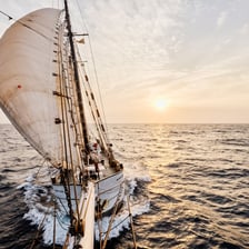 A boat traveling on the open ocean.
