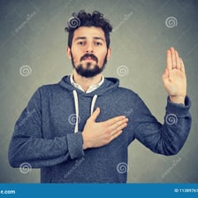 A person making a visibly sincere promise.