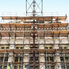 Workers renovating an older building