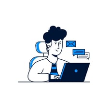 A person composing and sending an email on a laptop.