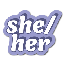 A name badge displaying the pronouns she/her