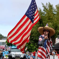 A Fourth of July parade with American flags