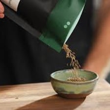 A small amount of seasoning being added to a dish