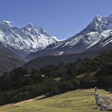 Mountain peaks covered with bright white snow.