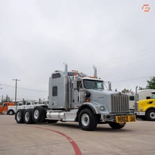 Several semitrailer trucks used for hauling.