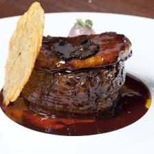 A plated restaurant entrée serving as the main course