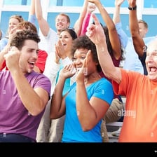 A crowd calling out mockingly toward a performer.