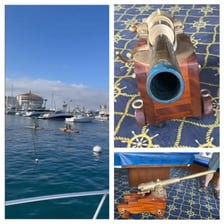 A tugboat in a harbor sounding its horn
