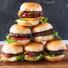 A plate of small slider hamburgers