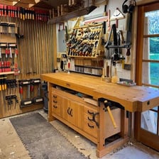 A workshop workbench equipped with hand tools.
