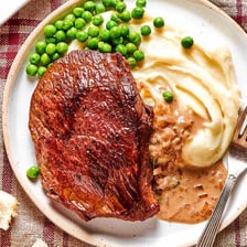 A hearty, substantial meal featuring a thick steak.