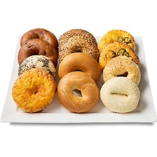 Several ring-shaped bagels displayed at a bakery.