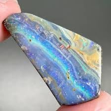 Polished Australian opals displaying flashes of blue, green, and orange.