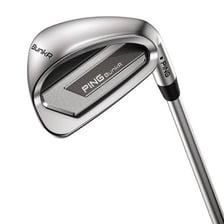 A golf sand wedge beside a ball in a sand bunker
