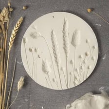 A visible impression pressed into a piece of clay
