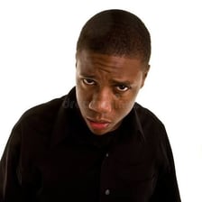 A person with a puzzled, uncertain expression.