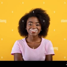 A smiling person with a friendly, approachable expression.