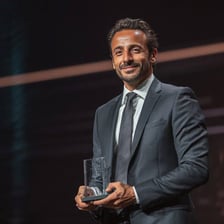 A person being praised during an award ceremony.