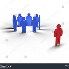 One person standing apart while a larger group remains together.