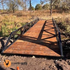A solid wooden bridge illustrating durability and robust construction.