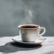 A steaming cup of freshly brewed coffee.