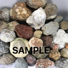 A disorderly cluster of rocks gathered into a single mass.