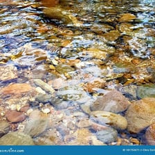 Water flowing continuously through a rocky river channel