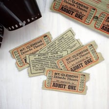 A vintage admission ticket made from stiff cardboard