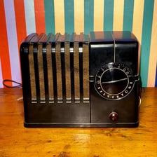 Vintage objects made from the dark reddish-brown plastic Bakelite.