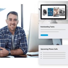 A website manager working at a computer with a site displayed on the screen
