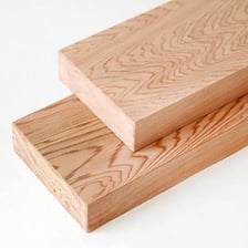 Cut timber boards with flat sawn surfaces.
