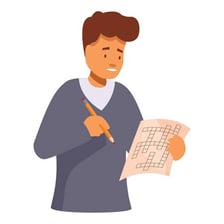 A person working out a word puzzle on paper.