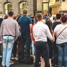 A person watching an event take place