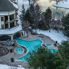 An outdoor swimming pool operating in cold weather.