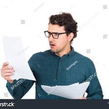 A person briefly looking over a document