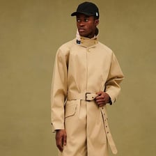 A classic waterproof raincoat in the style of a mackintosh.