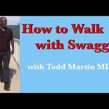 A person walking with an exaggeratedly confident posture.