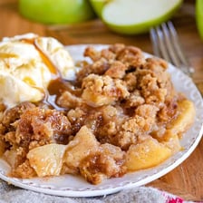 A dish of baked apple crisp with a crumbly topping.