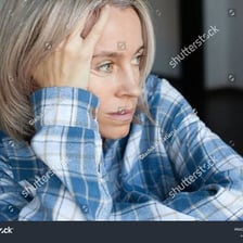 A person with a visibly unhappy, cheerless expression