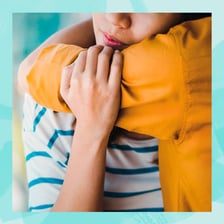 A person offering sympathy to someone who is grieving