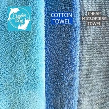 A wet towel beside a drier towel.