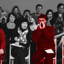 A fictional villain on stage receiving negative reactions from an audience.